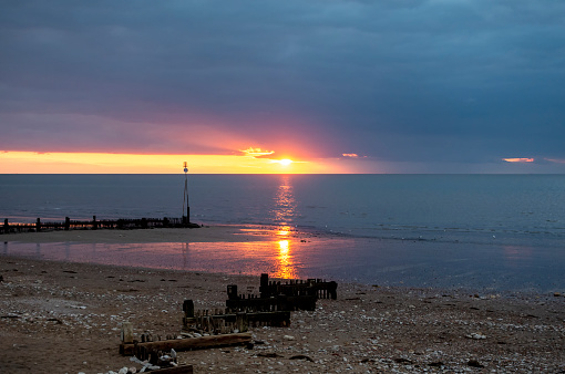 The beach at Hunstanton on the West coast of Norfolk, Eastern England, at sunset.