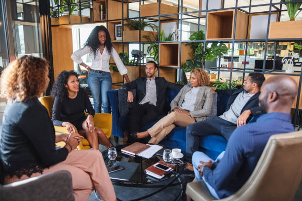 istock Handsome Multiracial Employees Talking And Drinking Coffee At Work 1438719383