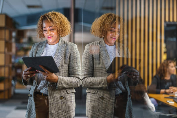 istock Successful Hispanic Female Entrepreneur Working With A Digital Tablet 1438719494