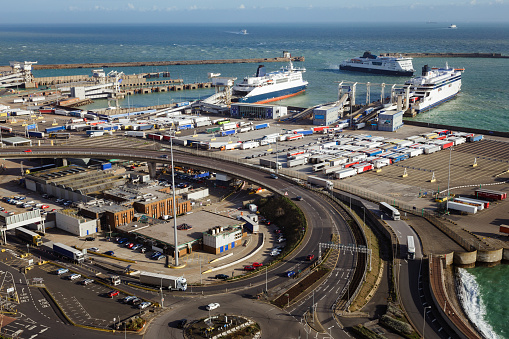 A large number of HGV trucks waiting to board the ferry from the port of Dover in Kent, UK, carrying freight for transportation to mainland Europe.
