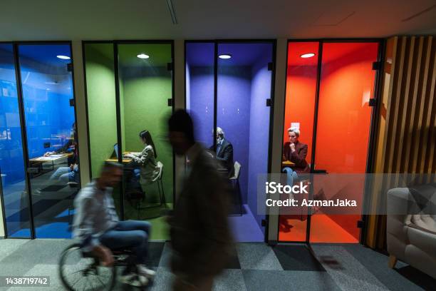 Employees Using Technology Multiethnic Office Employees Using Wireless Technology While Working In ...