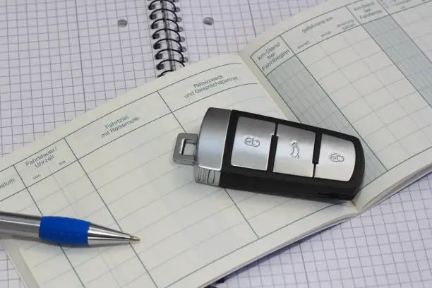 a blank logbook with car keys