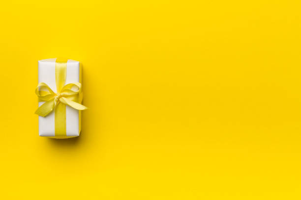 istock White gift box on color background, top view 1438720113