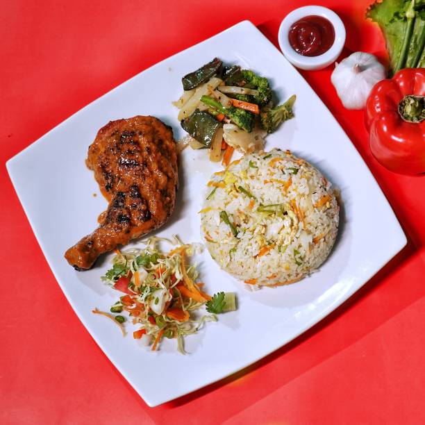 chicken peri peri platter with fried rice, salad and dip served in dish top view of fastfood - grilled chicken fotos imagens e fotografias de stock