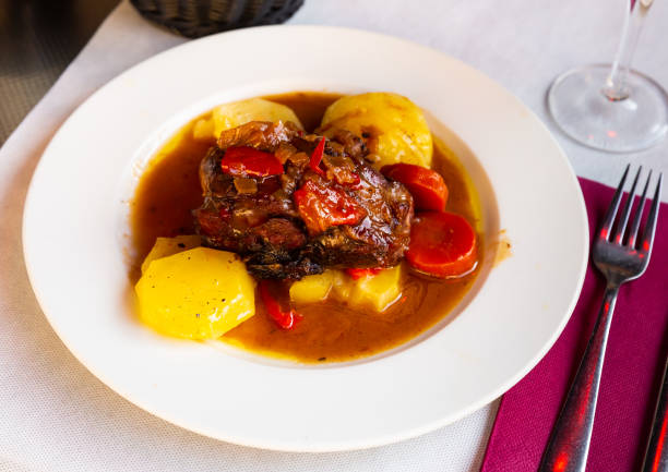 istock Baked lamb shoulder with vegetables 1438722355
