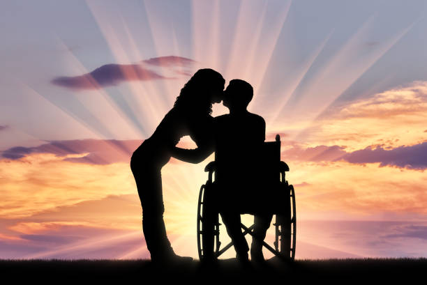 Man embracing his handicap woman and walking up on the stairs. iStockalypse 2012 in Berlin.