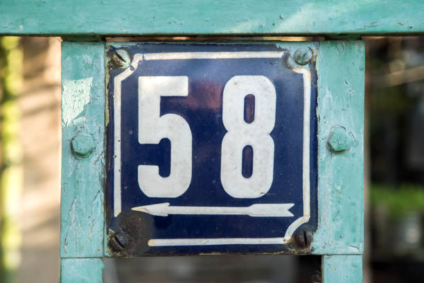 istock Weathered enameled plate number 58 1438724249