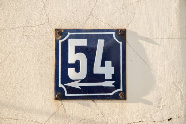 istock Weathered enameled plate number 54 1438724282