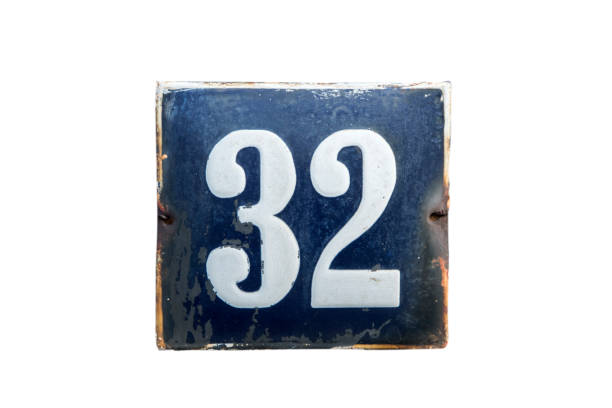 istock Weathered enameled plate number 32 1438724345