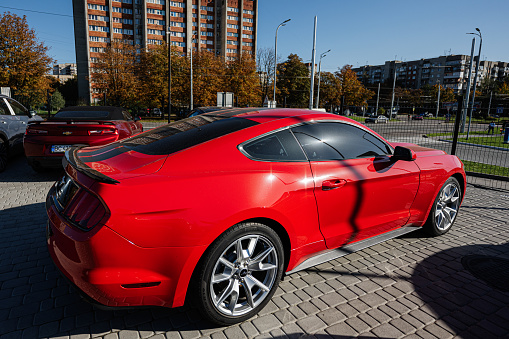 Lviv, Ukraine - October 09, 2022: Red Ford Mustang, american muscle cars on car  market.