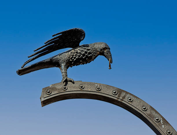istock raven with a ring in its beak royal 1438725859