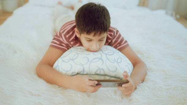 istock A young Indian enjoying smartphone games at home. 1438725892