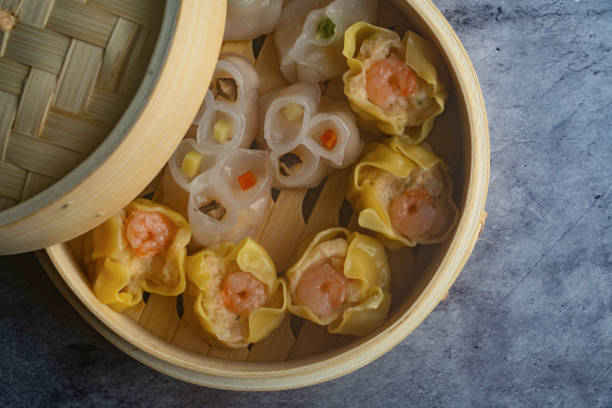 istock Dim Sum mix steamed in bamboo  wood basket. 1438728405