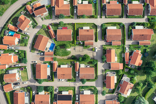 Aerial view of a street in a modern residential district with houses in summer in Västerås, Sweden.