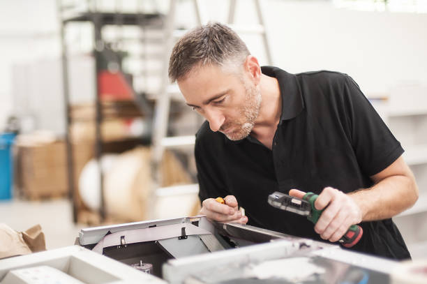 Technician troubleshooting and maintains the machines in the printing house All machines nead maintains. Professional technician troubleshooting and repair the machines in the printing house. computer printer stock pictures, royalty-free photos & images