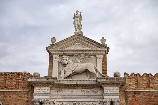 Venice, Italy - October 10th 2022:  Large relief of the Lion of St. Mark over a gate in the center of the old and famous Italian city Venice