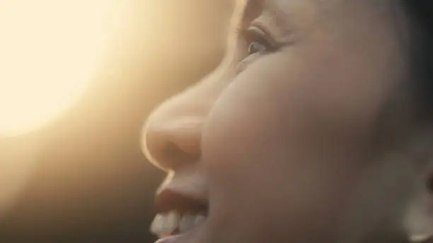 Photo of Close-up of a happy Asian woman laughing.