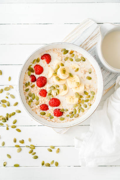 istock Banana, quinoa and raspberries in a bowl 1438744536