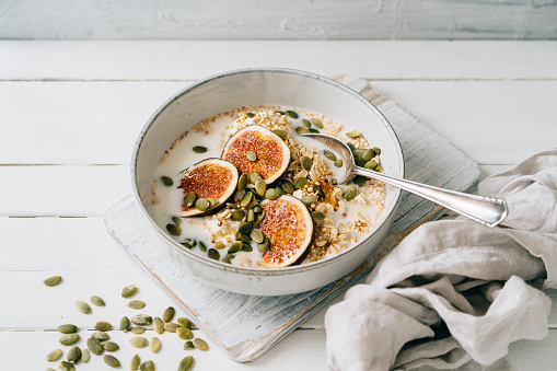Figs, oats and quinoa in a bowl