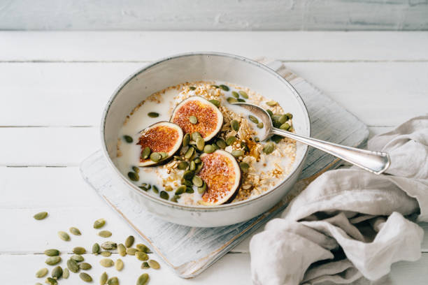 Figs, oats and quinoa in a bowl stock photo