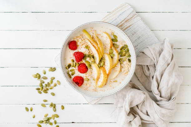 Raspberries, oats and pear in a bowl