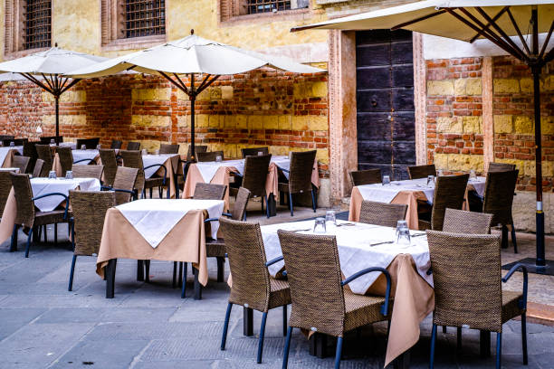istock typical italian sidewalk cafe - restaurant 1438744917