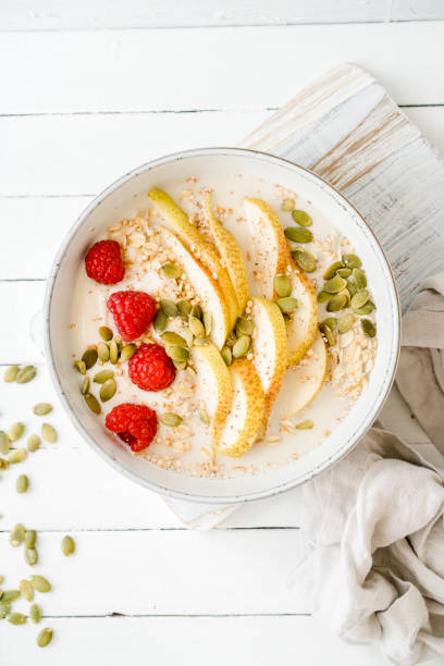 istock Raspberries, oats and pear in a bowl 1438744957