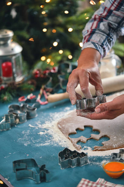istock Preparing Gingerbread Christmas Cookies in Domestic Kitchen 1438745250