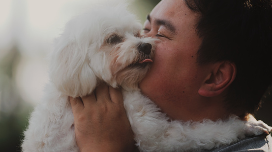 asian men take care of his dog