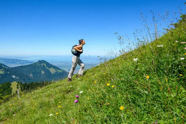 Photo of Young woman hiking in the mountains