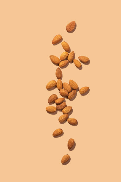 istock Peeled almonds on a beige background 1438749546
