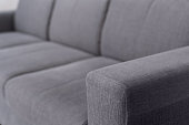 selective focus on upholstery of grey sofa
