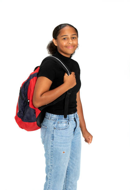 Black, teenage girl holding a backpack
