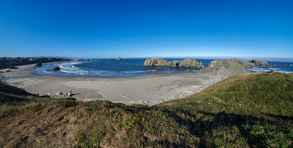 Panorama of the Bandon, Oregon beach from above early morning with no people.