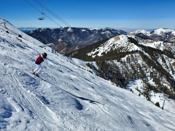 Expert mature woman mogul skier. Kachina Peak, Taos, New Mexico. stock photo