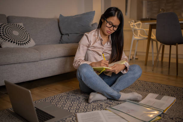 istock Young woman working from home 1438769179