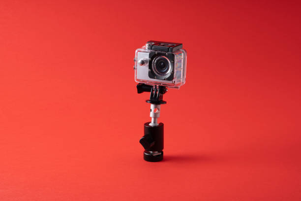 istock Photo of action camera on red background 1438769237
