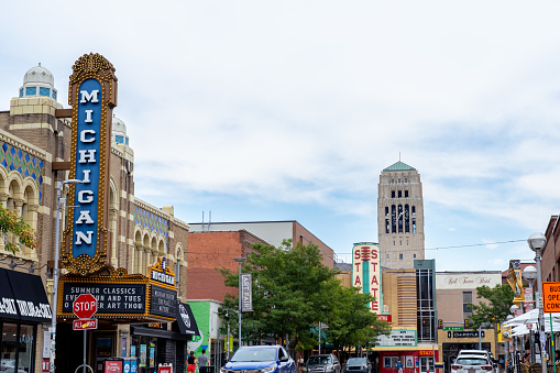 Ann Arbor Michigan - August 20 2022: Theater buildings with Michigan and State signs on a busy street in Ann Arbor