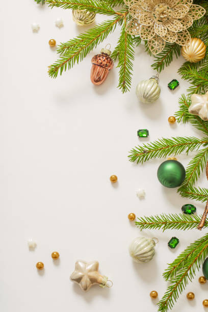 istock golden and green  christmas decorations  on white  background 1438775174
