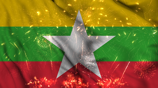 Myanmar flag seamless animation with fireworks. Best stock of Myanmar flag nation wave. Independence day, a happy new year with fireworks and flag background Waving in the Wind Continuously