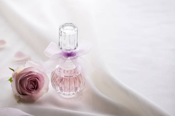 istock Perfume bottle and rose flower 1438785051