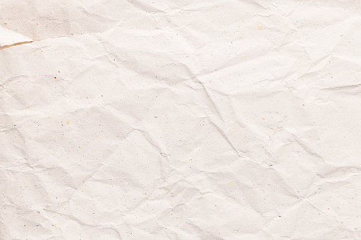 Closeup of white wrinkled paper texture background.
