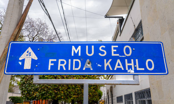 A sign directing pedestrians to the Frida Kahlo Museum with a bullet hole in it in Mexico City Mexico City Mexico - February 12 2022: A sign directing pedestrians to the Frida Kahlo Museum with a bullet hole in it in Mexico City frida kahlo museum stock pictures, royalty-free photos & images
