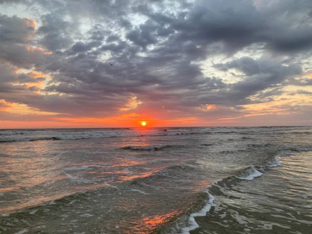istock Moody sky and sunrise over the Atlantic Ocean 1438795729