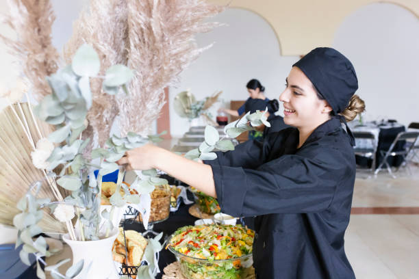 istock Cook arranging the decorations on the buffet table 1438800393