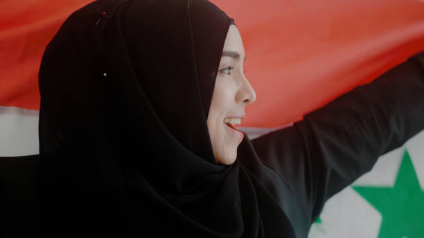 istock Iraqi women hold protest flags 1438800945