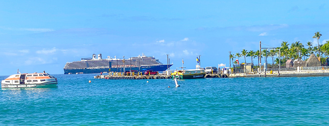 October 14, 2022 Kona, Hawaii.  A cruise ship sits off the coast of Kona, Hawaii.  This cruise ship allows tourists to visit the various islands of Hawaii.  On this bright day in October, it became a part of the harbor activity going on.