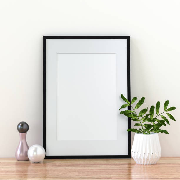 istock A picture frame on the floor with a flower vase. 1438803955