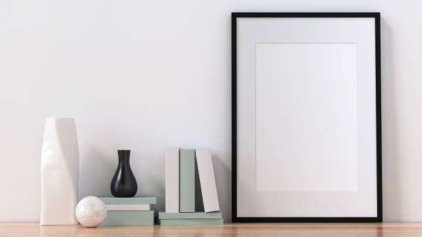 istock A picture frame on the floor with a flower vase. 1438803988