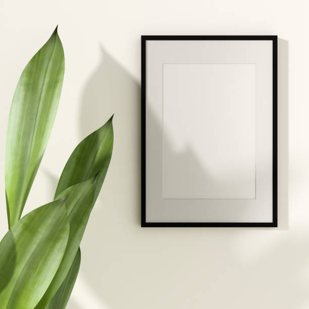 istock Picture frame mounted on the wall with flower vase 1438804023